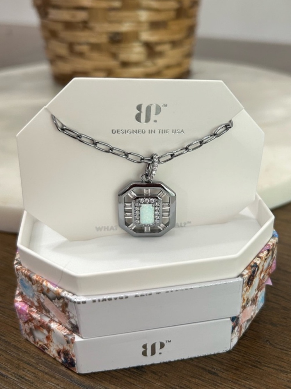 Bomb Party rhodium plated necklace featuring a lab-created milky white opal set